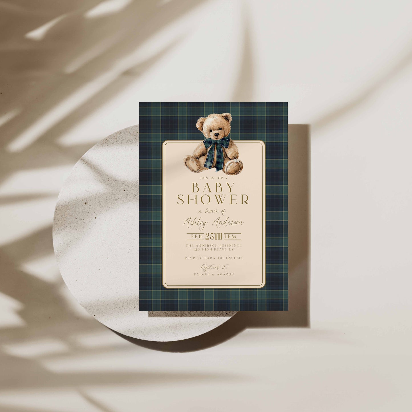 Baby shower invitation with teddy bear design on a plaid background