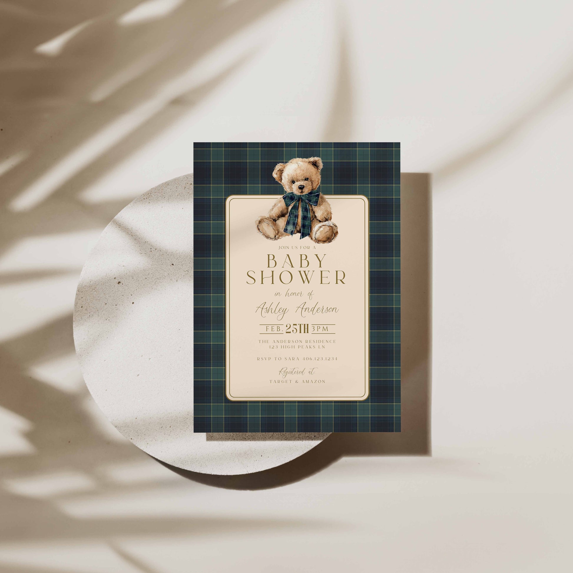 Baby shower invitation with teddy bear design on a plaid background