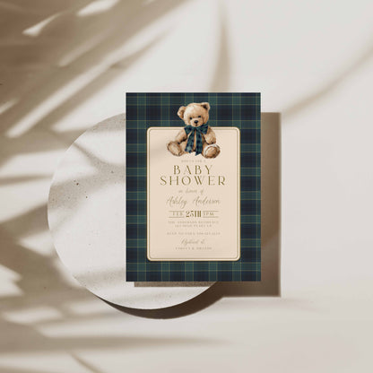 Baby shower invitation with teddy bear design on a plaid background