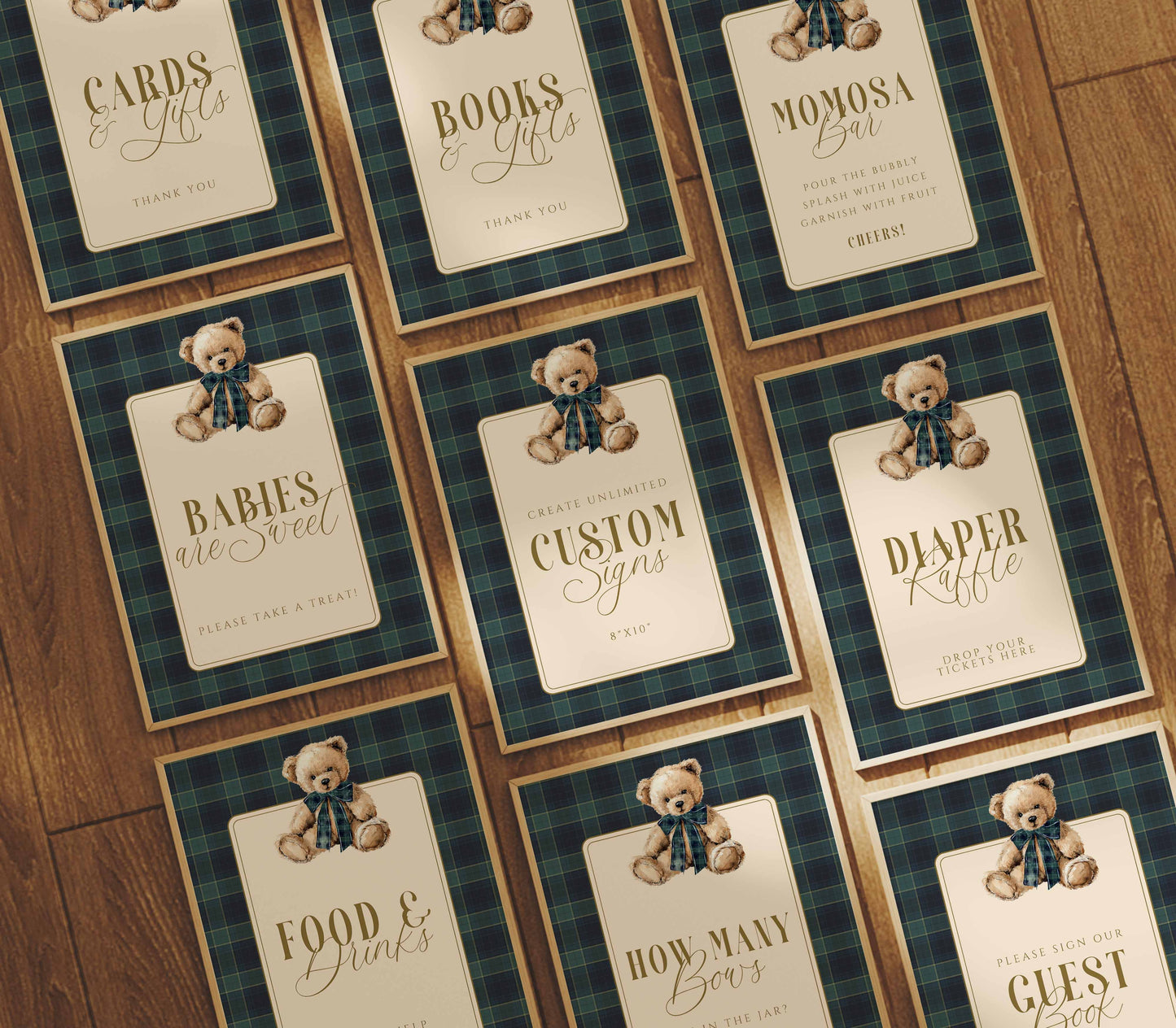 Collection of baby shower party signs with teddy bears and text on a wooden surface