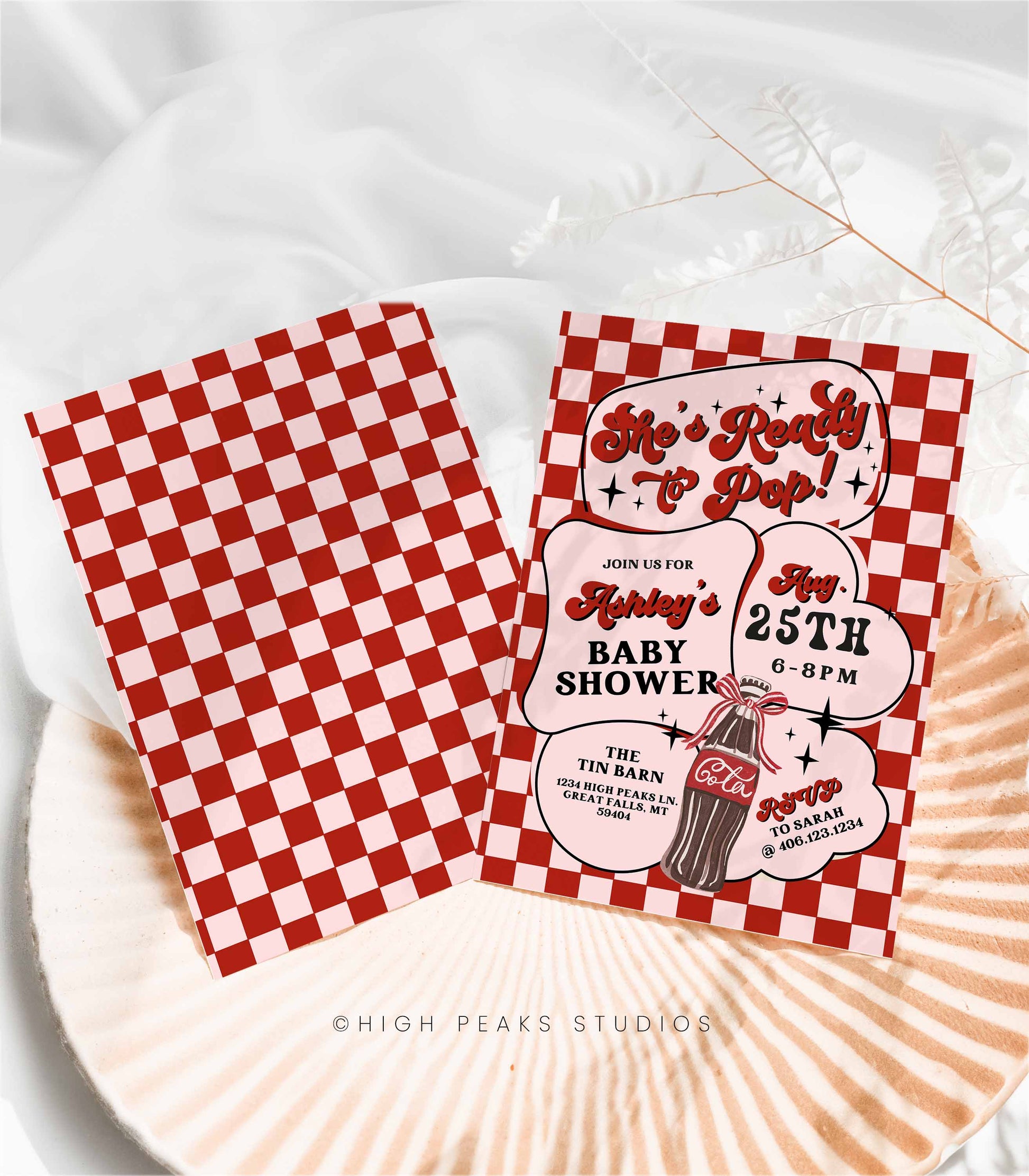 Red and white checkered baby shower invitations on a white surface with 'High Peaks Studios' branding.