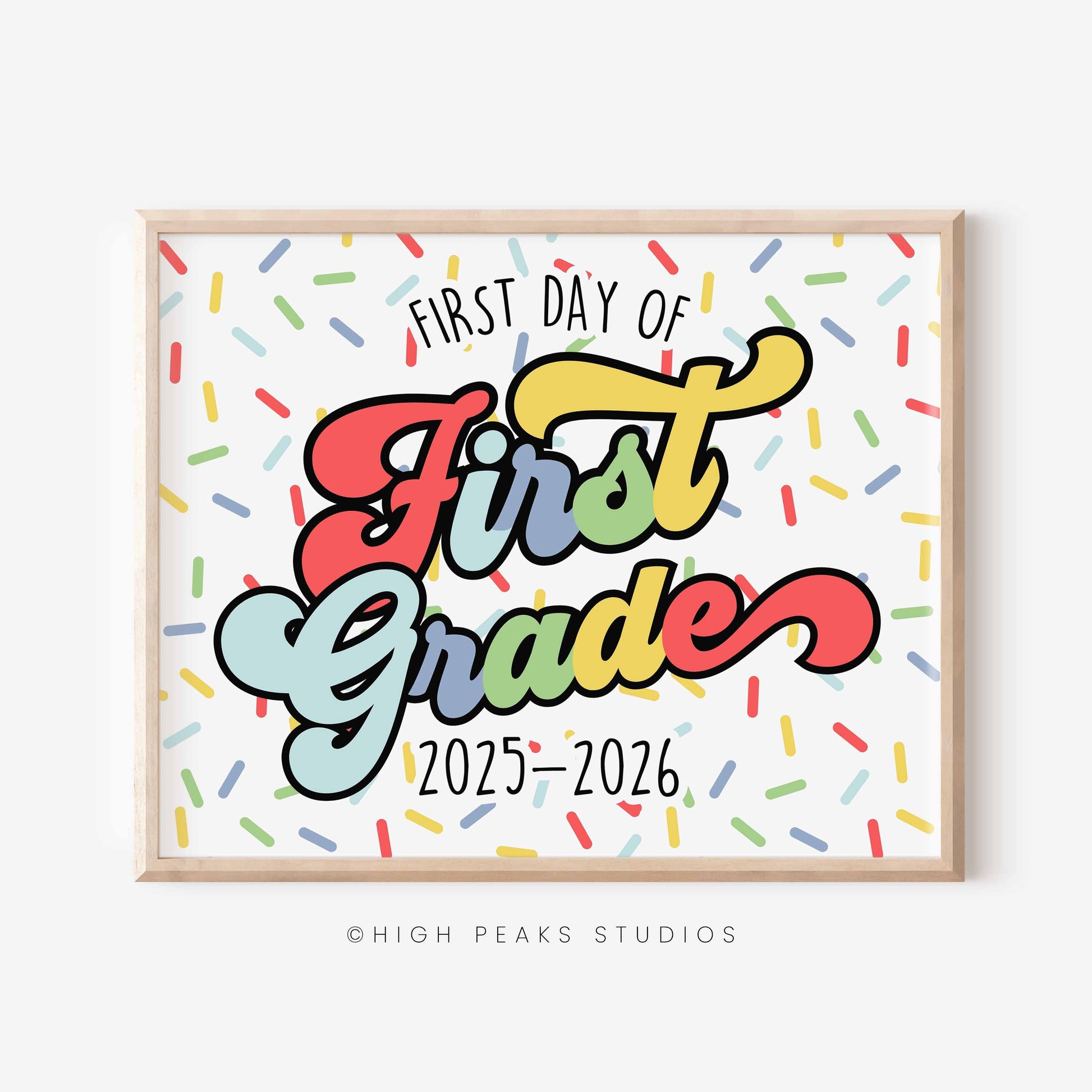 Framed poster with 'First Day of First Grade 2025-2026' text on a white background with colorful confetti. By High Peaks Studios LLC