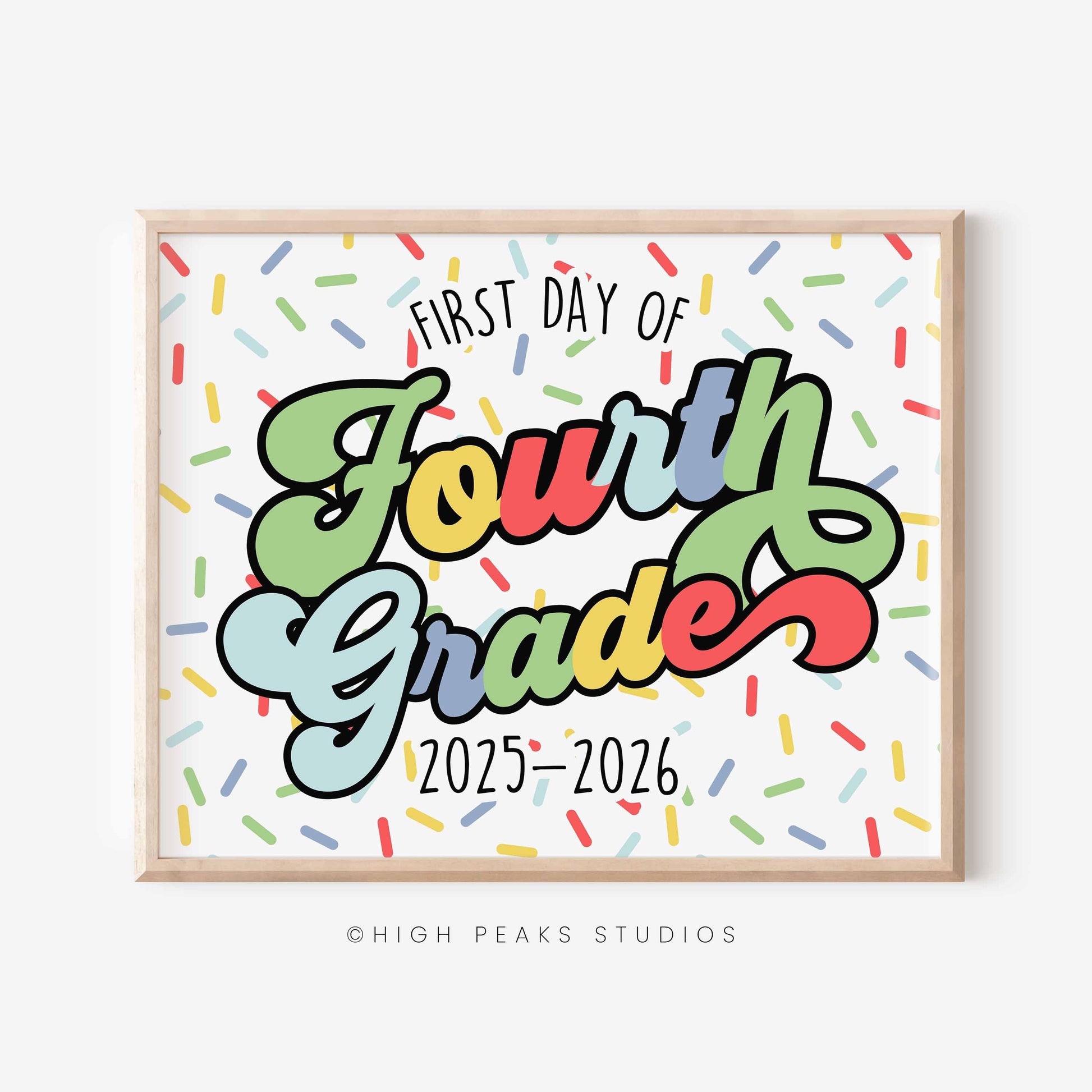 Framed sign with 'First Day of Fourth Grade 2025-2026' text on a colorful confetti background, branded 'High Peaks Studios'.